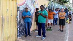 Voters in Brazil head to polls as Lula goes up against Bolsonaro's son
