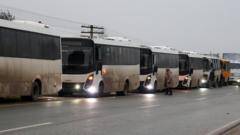Evacuees from Russia-occupied city where residents ate weeds on way to Ukraine