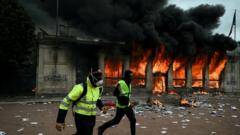 Violent clashes, looting and buildings ablaze as hundreds arrested after France protests